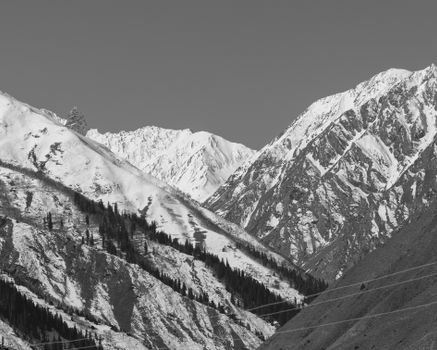 Stunning black and white view of snow-covered mountains and valleys in Minimarg, Pakistan.