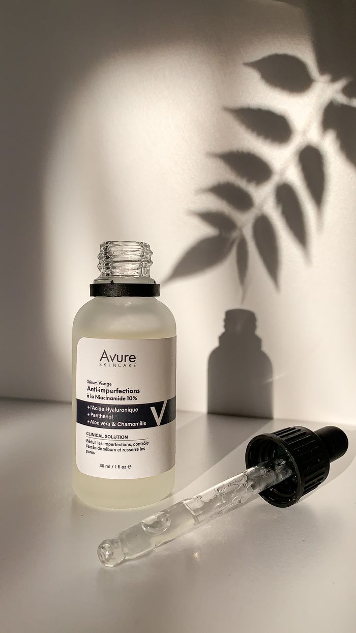 Minimalist skincare serum bottle in natural light