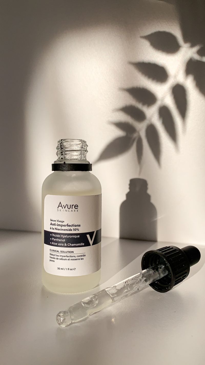 Side by side comparison of a cluttered beauty brand label and a minimal brand label demonstrating the visual hierarchy difference
