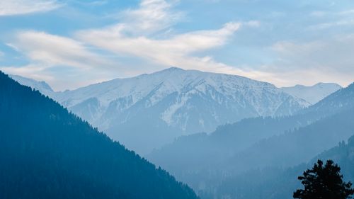 Free Serene view of snow-capped mountains and misty valleys in Gulmarg, Kashmir. Stock Photo