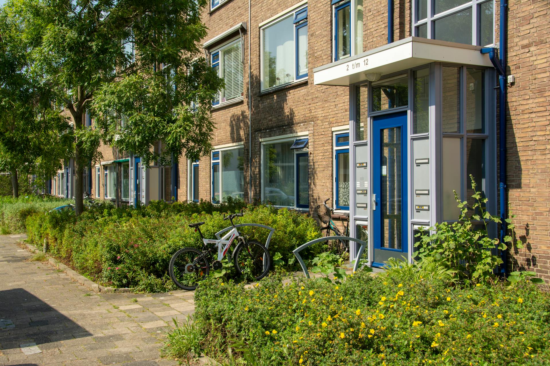 Charming Dutch apartment exterior with bikes in Voorburg, Zuid-Holland.