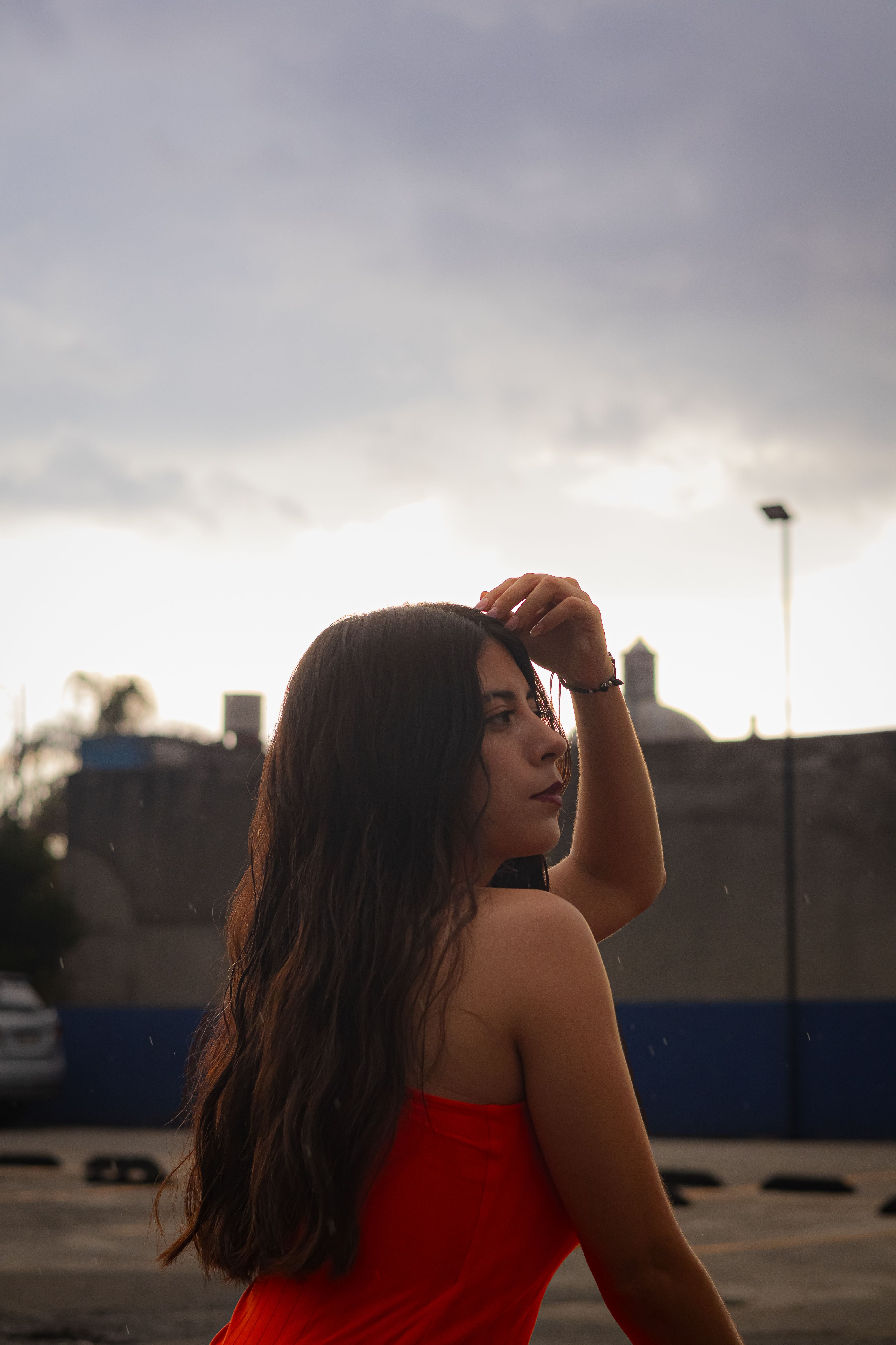 Portrait of Woman in Red Dress at Twilight · Free Stock Photo
