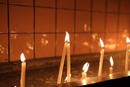 Free Candles burning brightly in a serene setting, offering warmth and tranquility. Stock Photo
