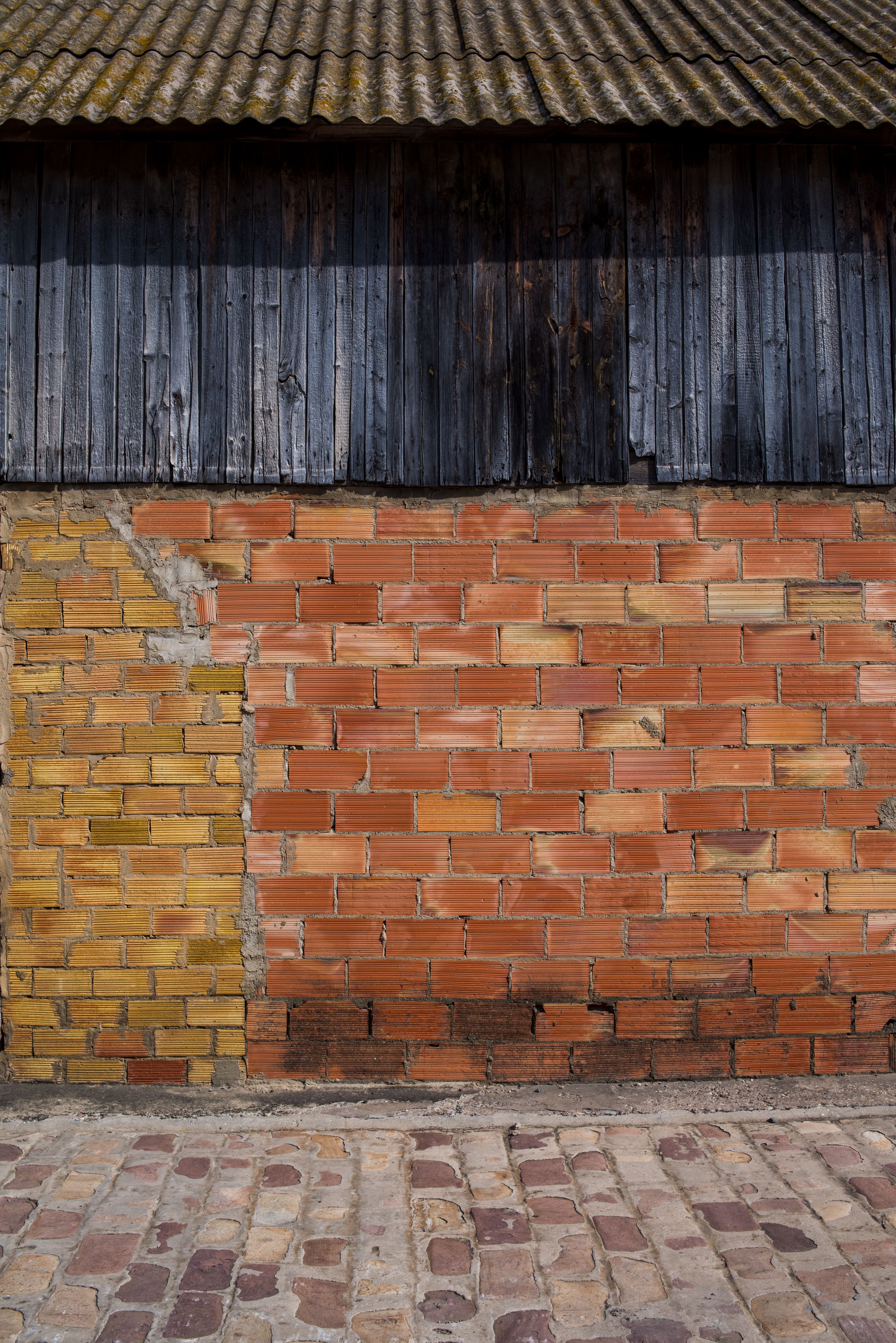 Textured Brick and Wood Exterior Wall · Free Stock Photo