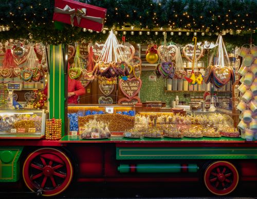 Free Colorful Christmas market stall with sweets and decorations in Berlin, Germany. Stock Photo