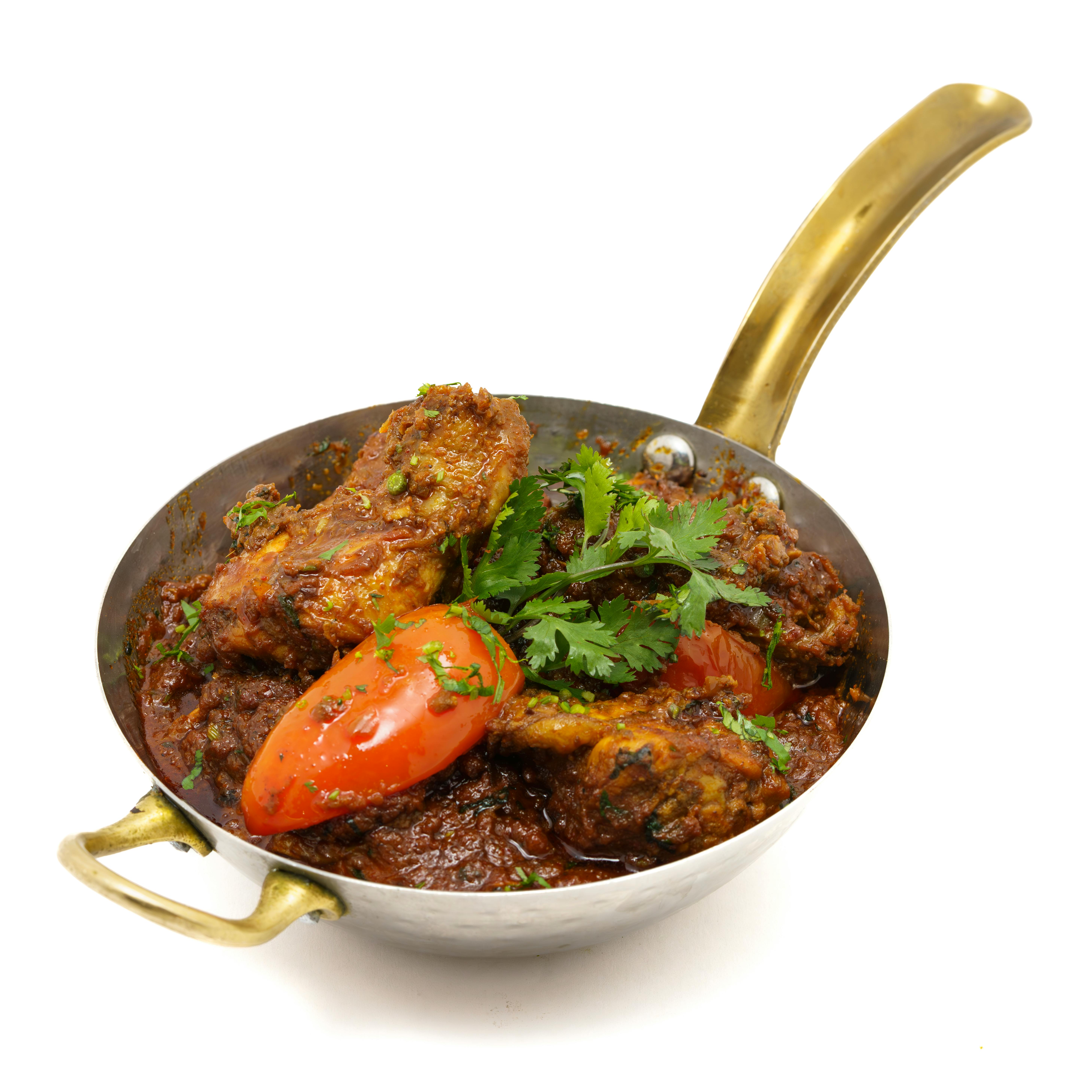 spicy chicken curry in traditional kadai