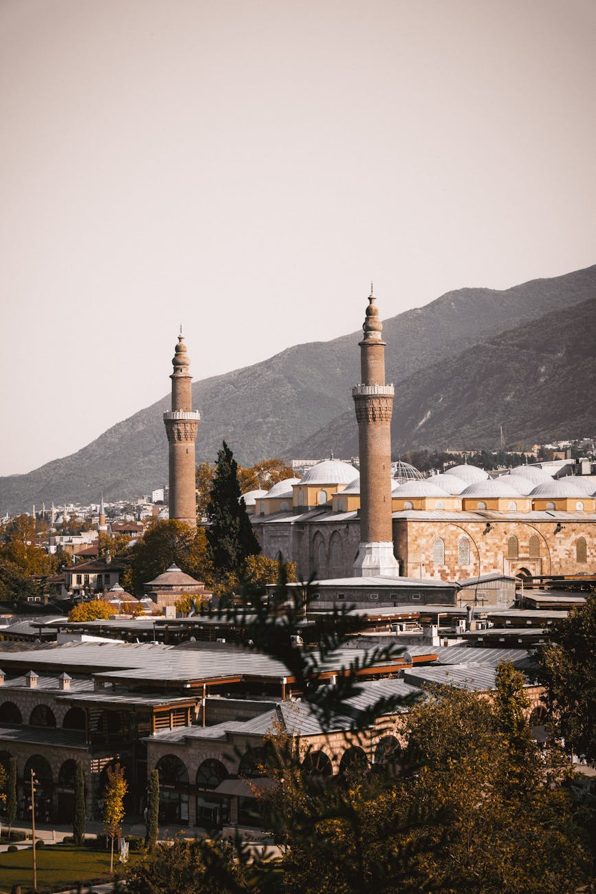 View of the Grand Mosque in Bursa, showcasing stunning Ottoman architecture and scenic landscape.