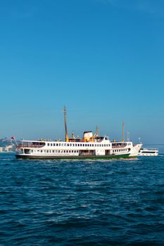 A ferry sails on the Bosphorus, capturing the essence of İstanbul's vibrant maritime activity.