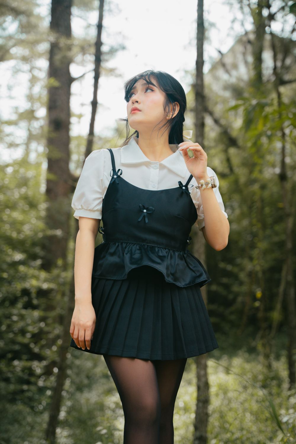 Young Woman in Black Dress in Forest Setting · Free Stock Photo