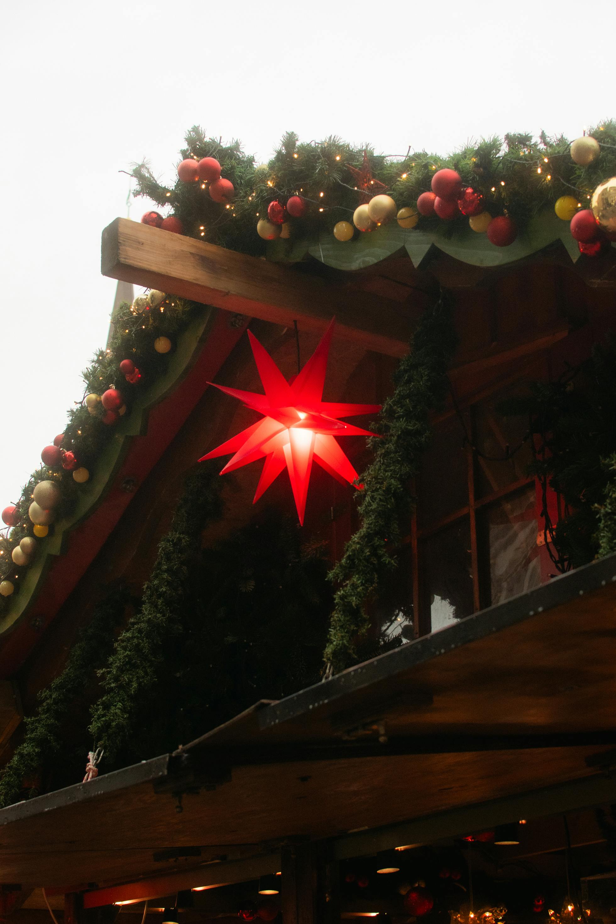 festive christmas decoration on market stall roof