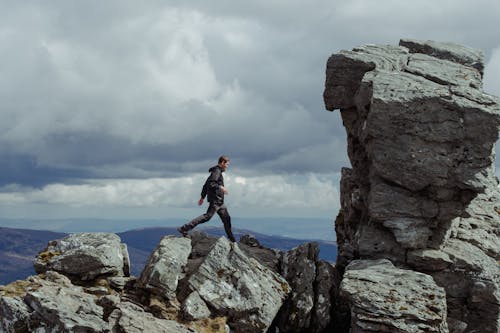 Man Walking on Rock Formations