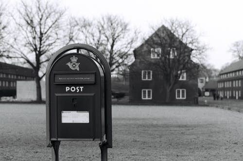 Grayscale Photo of a Post Box