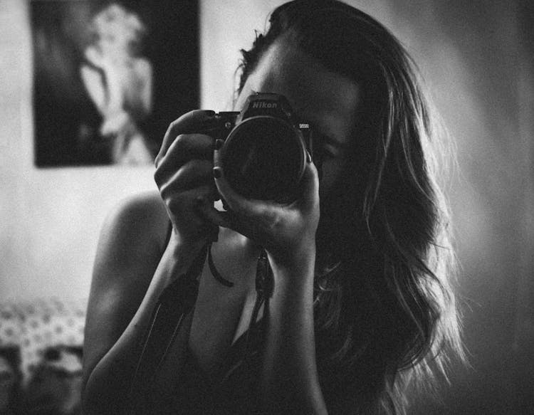 Woman Holding Camera