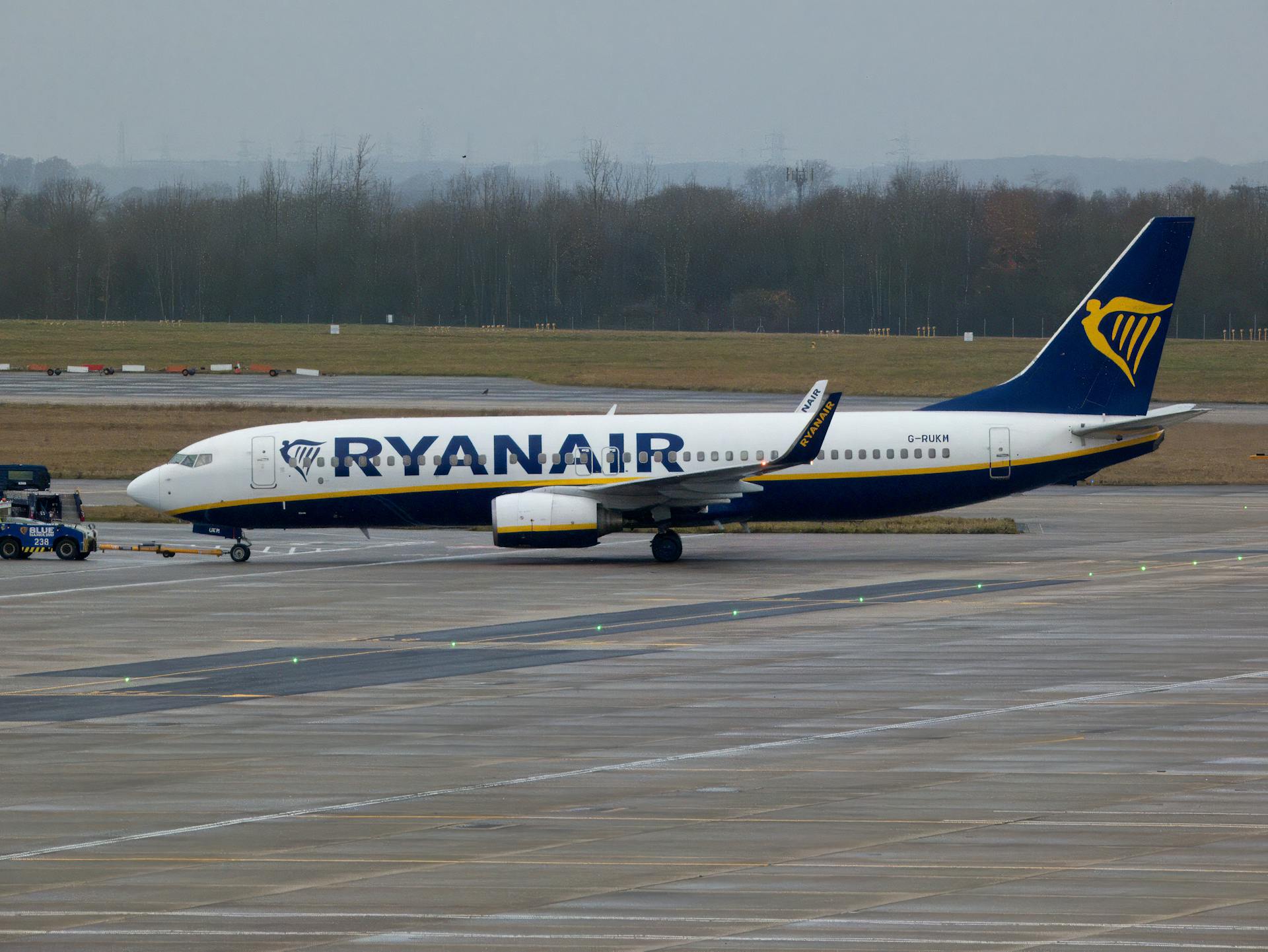 Ryanair aircraft on airport runway, ready for departure.