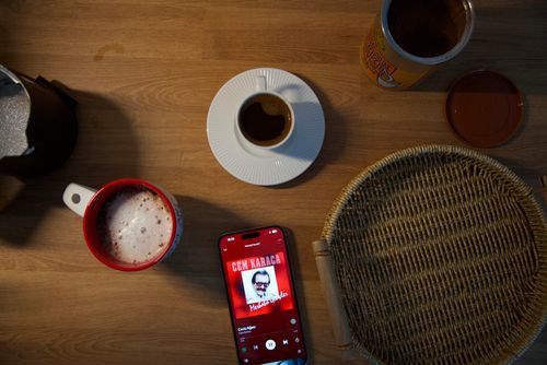 Free Top view of coffee setup with smartphone playing music, perfect for lifestyle themes. Stock Photo