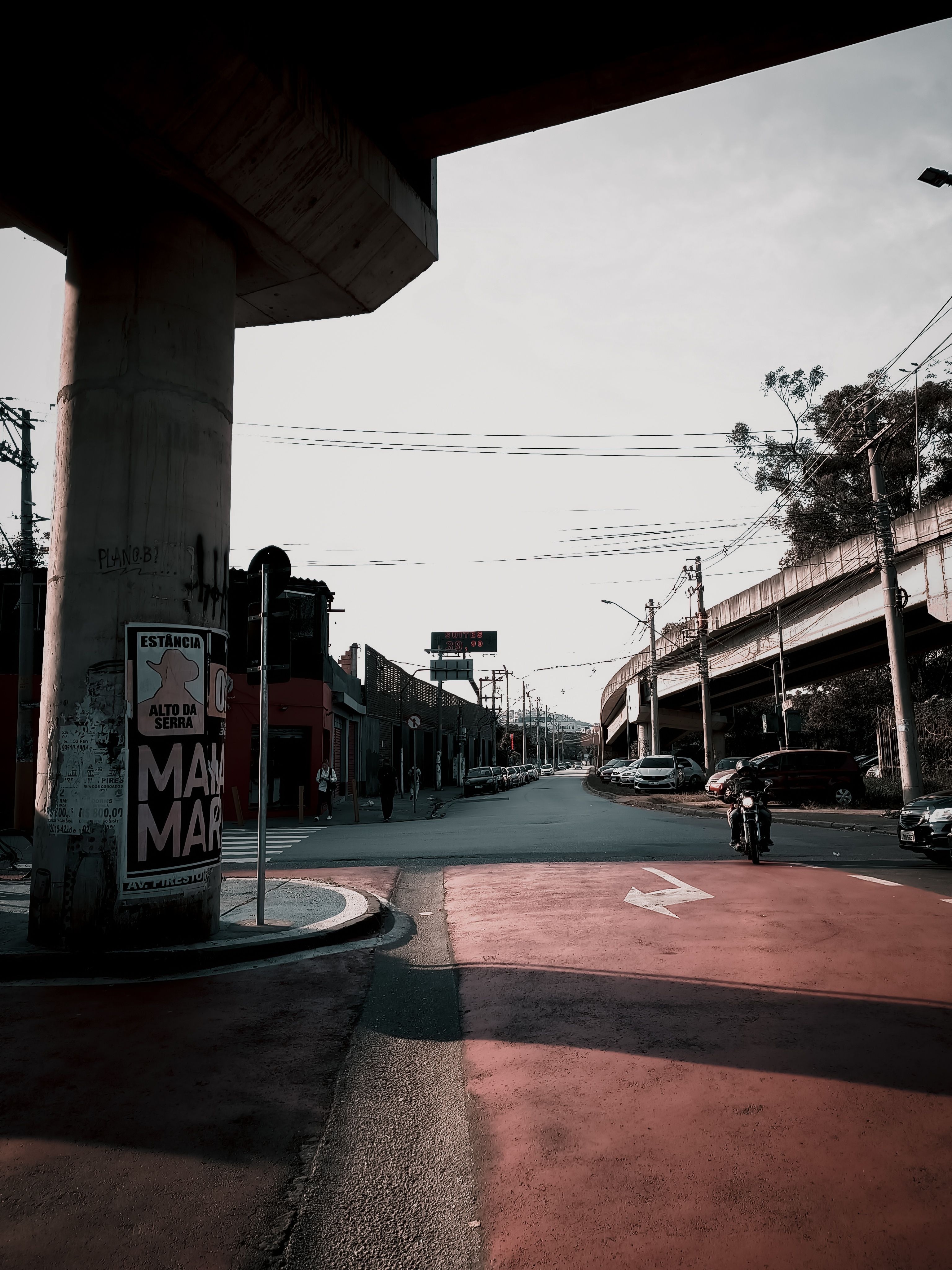 Urban street scene with overpass during day · Free Stock Photo