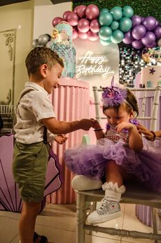 Adorable kids enjoying a vibrant birthday party in Balıkesir, Türkiye.