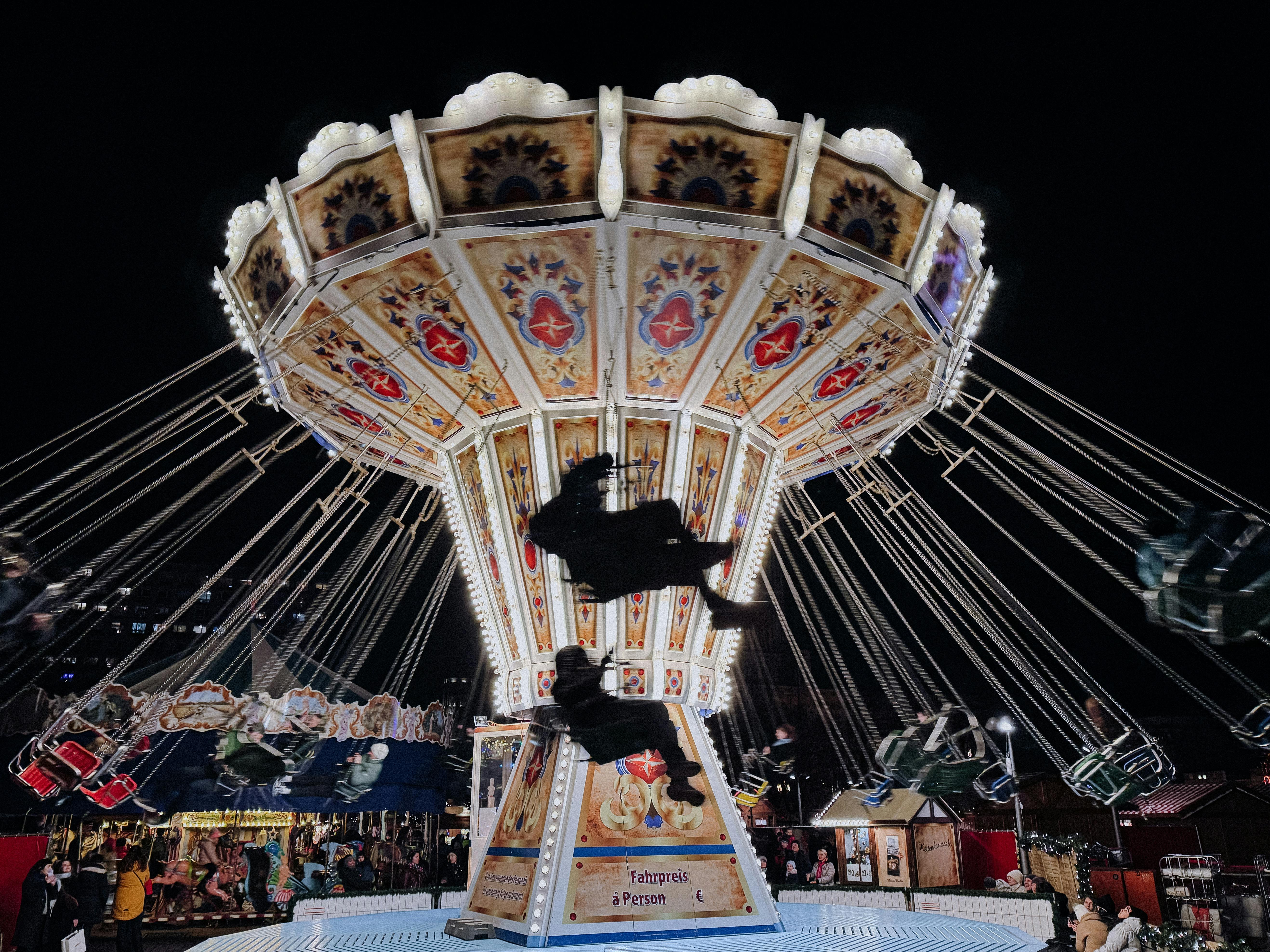 nighttime carousel at berlin christmas market