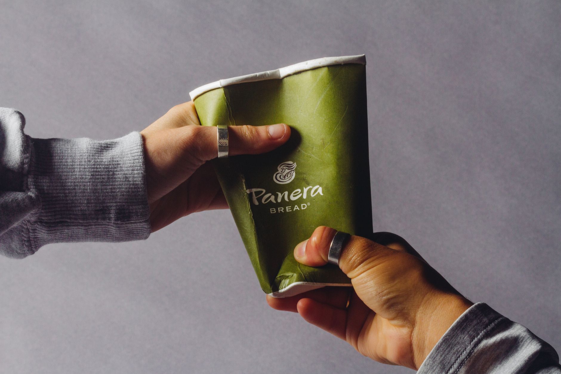 Green and White Disposable Cup