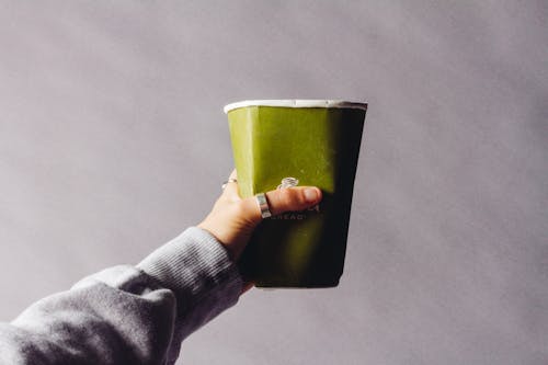 Person Holding Green Cup