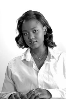 Elegant black and white portrait of a woman with jewelry in a minimalist style.