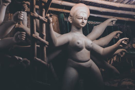 Intricately crafted clay sculpture of a Hindu goddess in Kolkata's traditional sculpture studio.