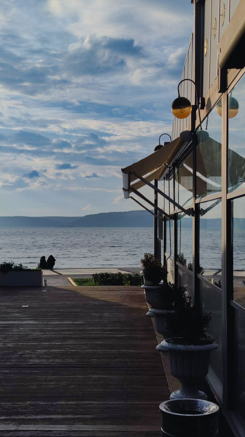 Seaside terrace overlooking the Mediterranean, set for an event