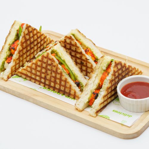 Free Grilled vegetable sandwich on a tray with ketchup, perfect for a healthy snack. Stock Photo