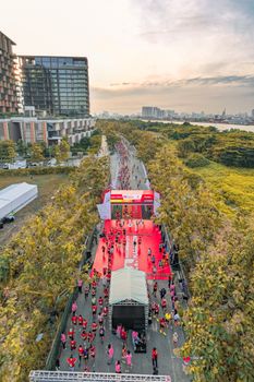 Dynamic aerial shot of a vibrant marathon event in Vietnam, showcasing athletes and cityscape.
