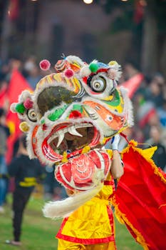 Vibrant dragon dance performance during a festival in Hanoi, Vietnam.