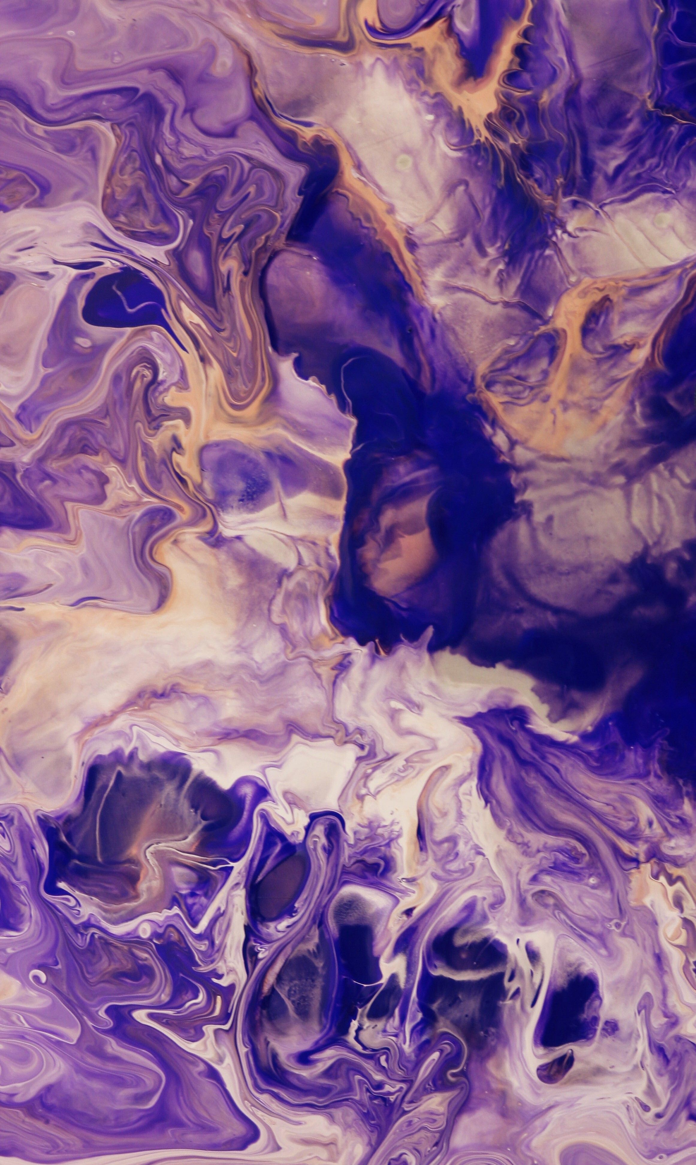 Abstract artwork featuring swirling patterns in shades of purple and beige, creating a fluid and artistic effect.