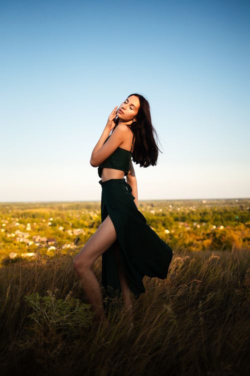 Chic Portrait of Woman in Green Dress Outdoors · Free Stock Photo