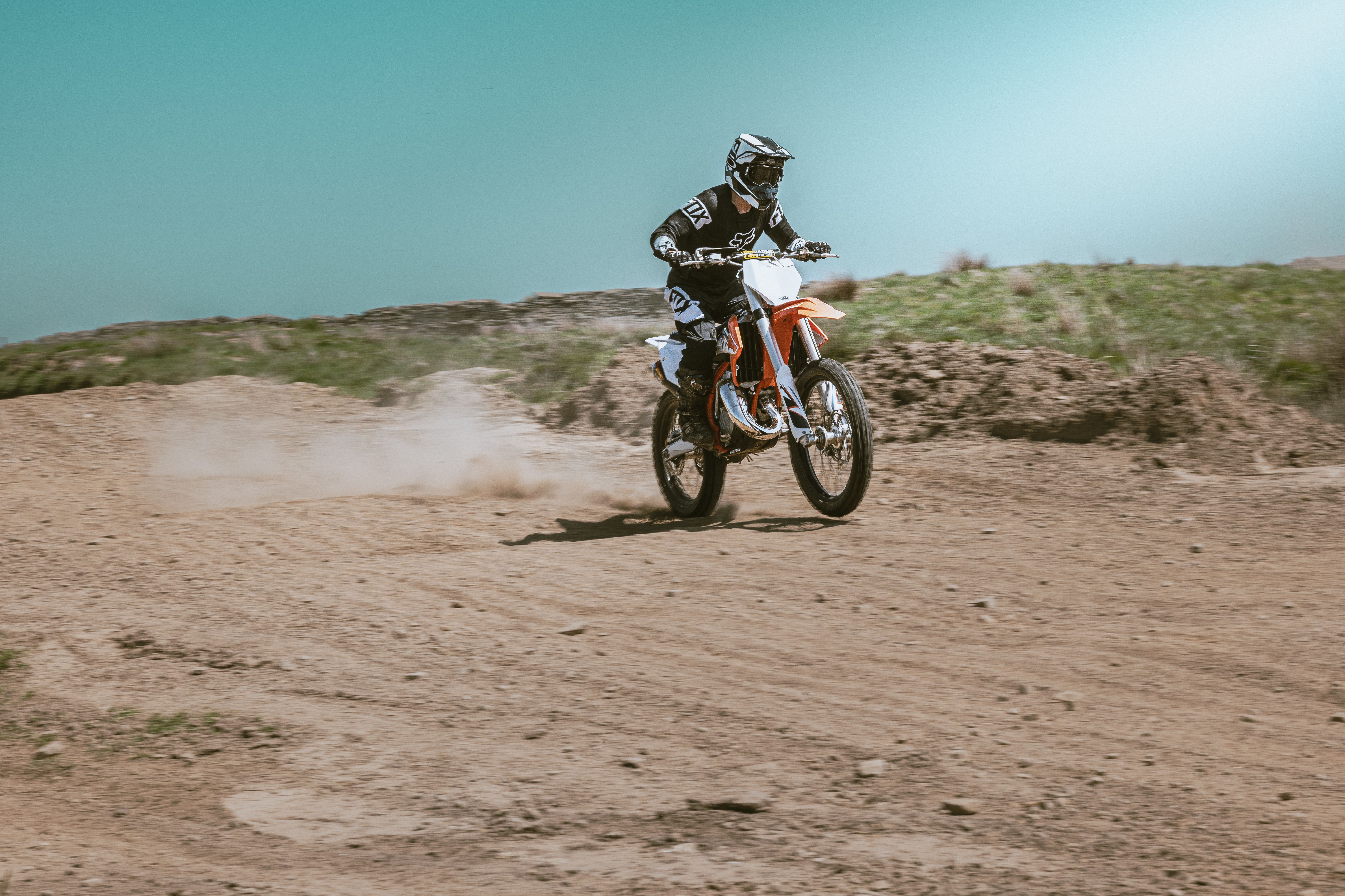 Motocross Rider Speeding on Dirt Track · Free Stock Photo