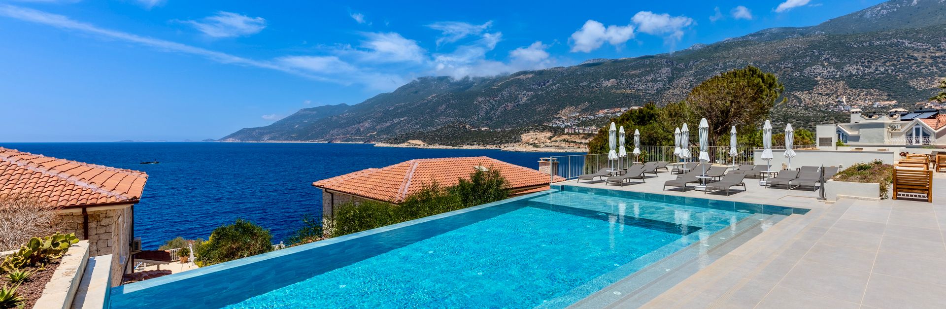 Stunning infinity pool overlooking the Mediterranean Sea, perfect for a luxury vacation escape.