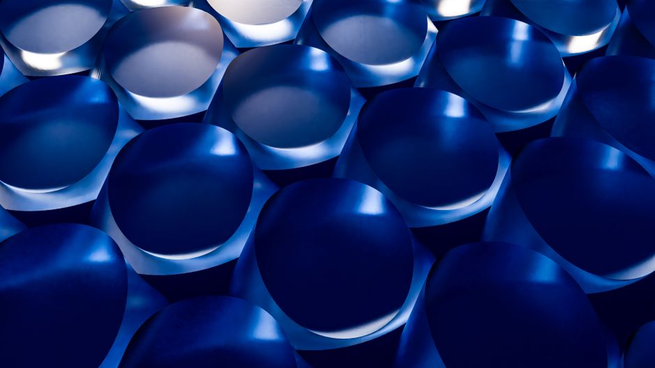 Dynamic abstract art featuring blue circles with geometric shapes, perfect for backgrounds.
