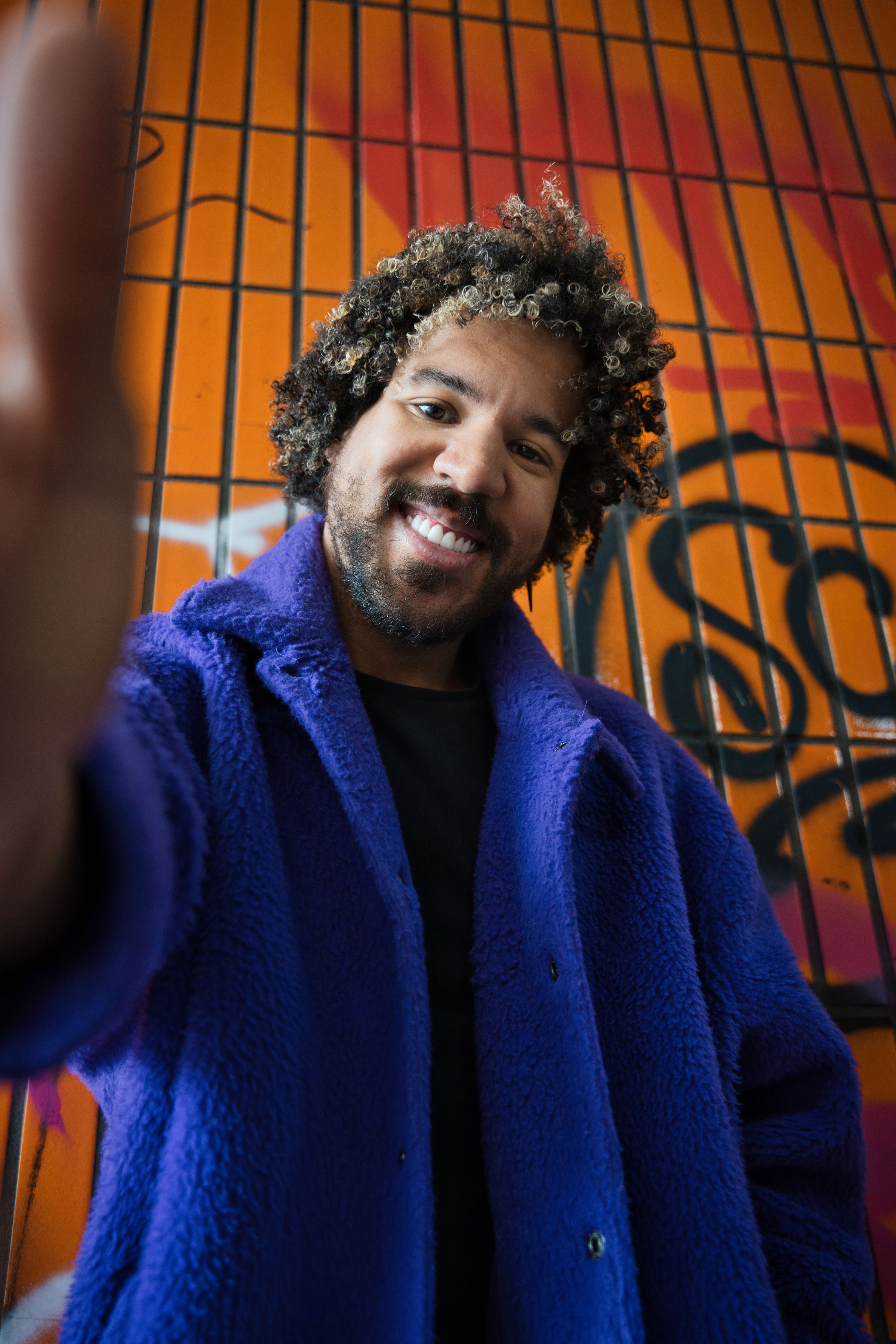 Colorful Portrait of Smiling Man in Berlin · Free Stock Photo