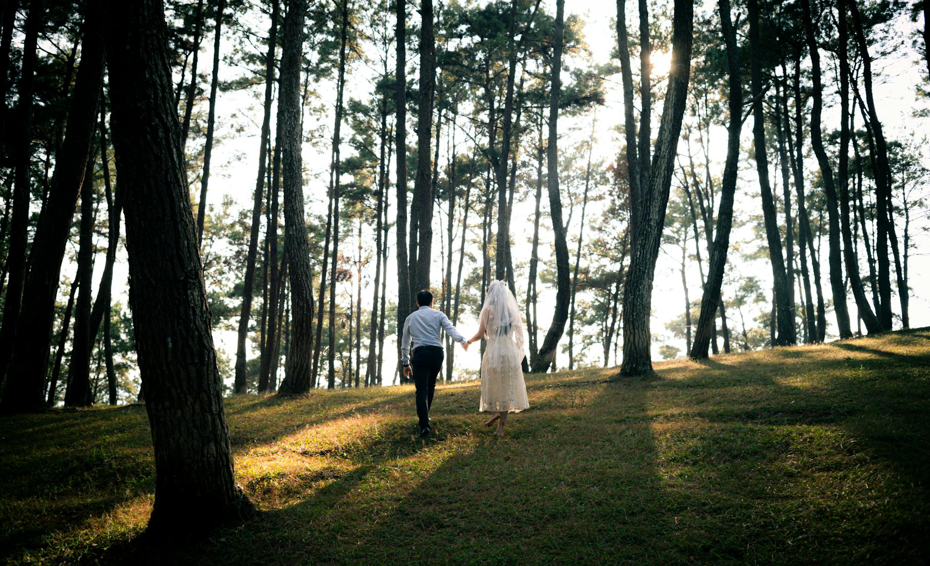 Couple during their elopement ceremony at a Kenai Fjords National Park landmark