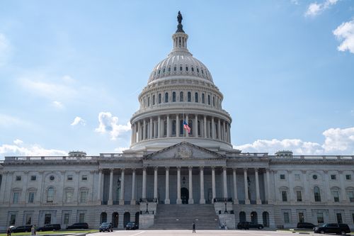 Free Stunning architectural shot of the US Capitol under a clear blue sky. Stock Photo