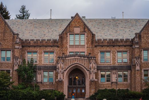 Facade of a historic university building featuring Gothic architecture and ornate stonework.