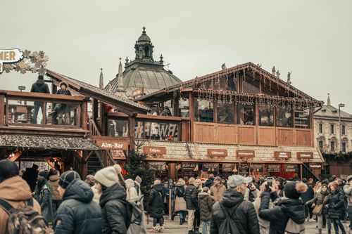 Free Festive atmosphere at Munich's famous Christmas market with crowds and decorations. Stock Photo