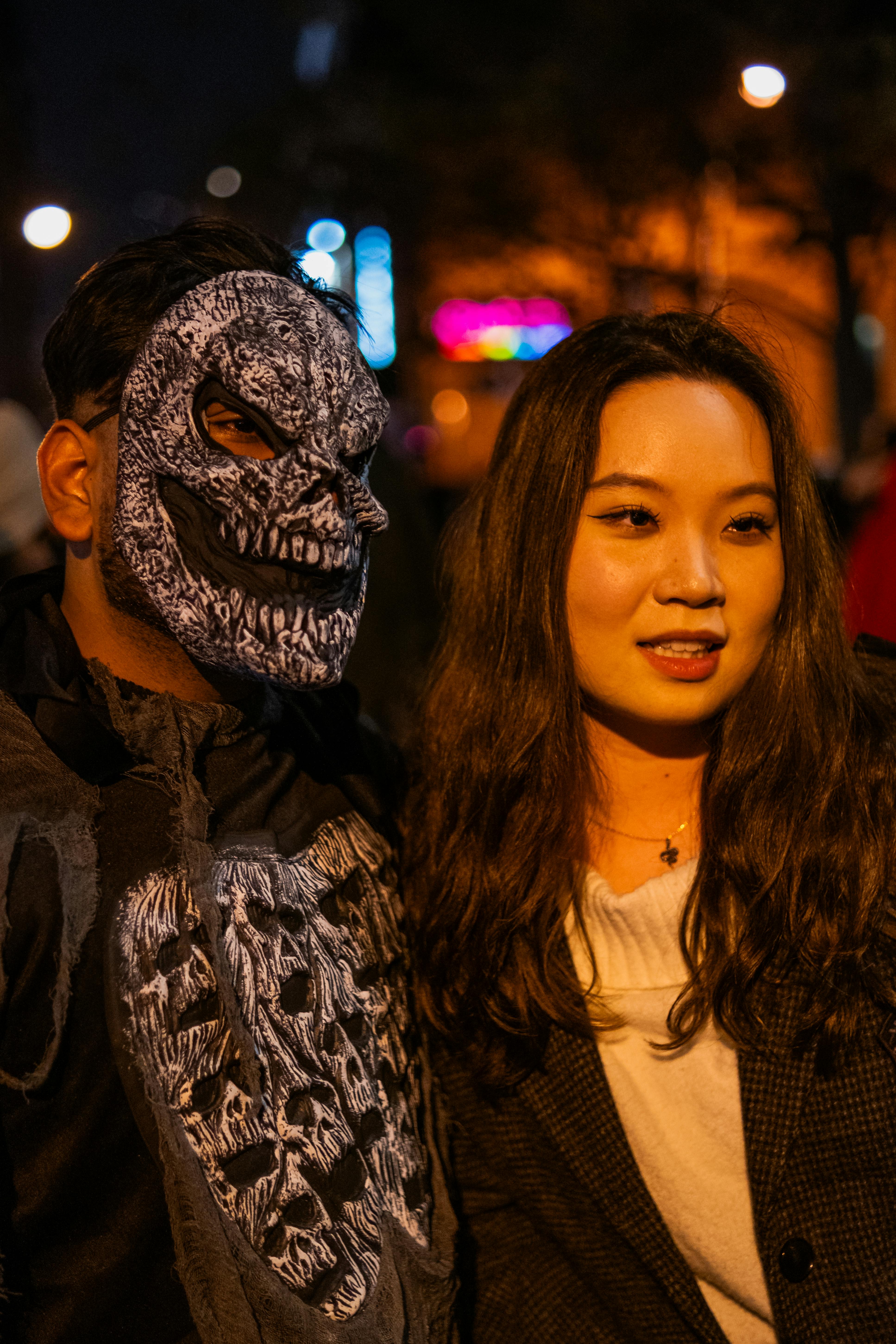 Two people in Halloween costumes enjoying a night out in Toronto.