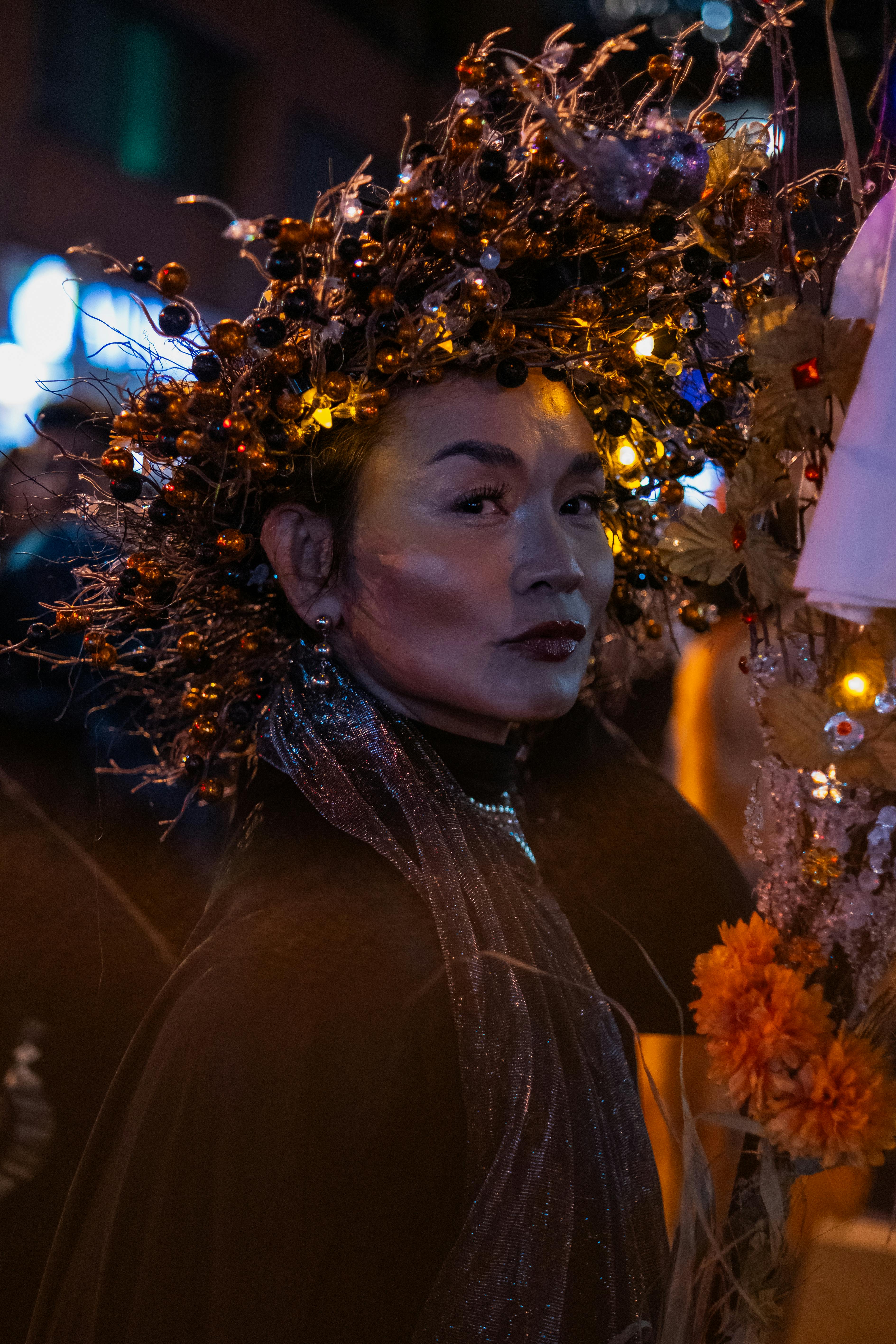 A Halloween-themed street portrait featuring a festive costume and intricate headpiece in Toronto.