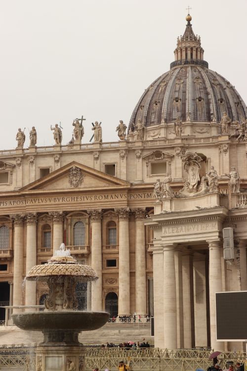 Free View of St. Peter's Basilica with a fountain in the Vatican City. Stock Photo