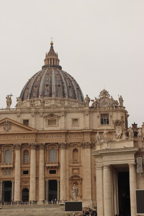 Free A detailed view of St. Peter's Basilica's stunning architecture in Vatican City. Stock Photo