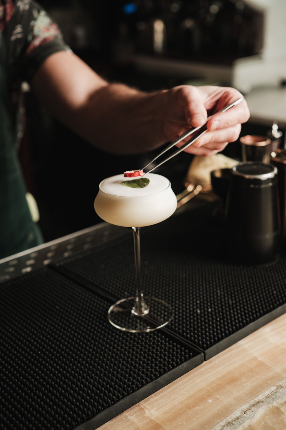 Bartender Garnishing a Classic Cocktail · Free Stock Photo