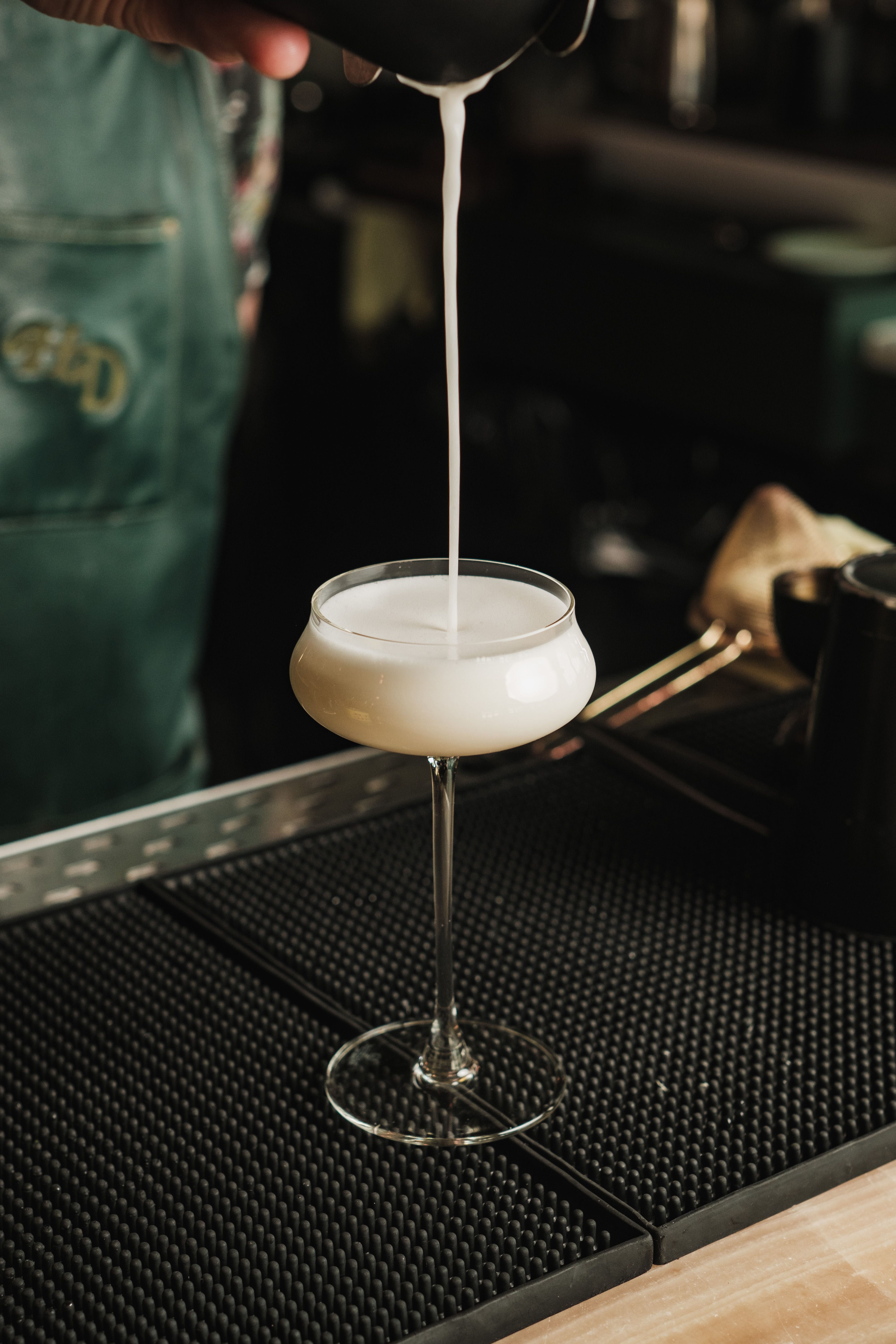 Bartender Garnishing a Classic Cocktail · Free Stock Photo