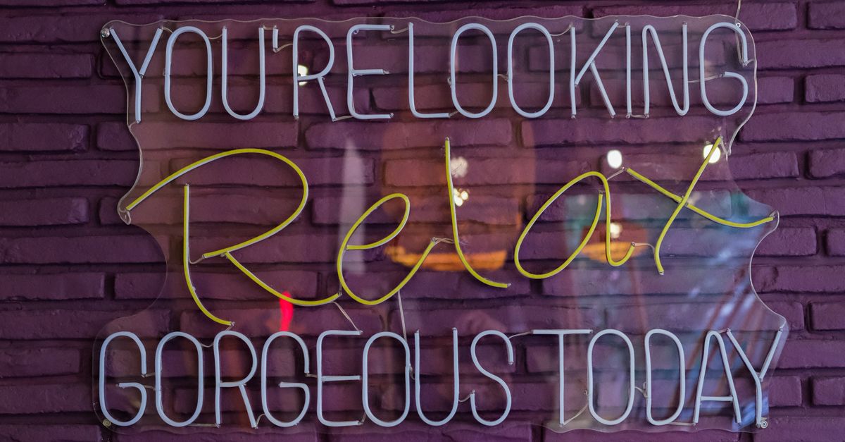 Nice Color Sign Colorful neon sign on purple brick wall · Free Stock Photo