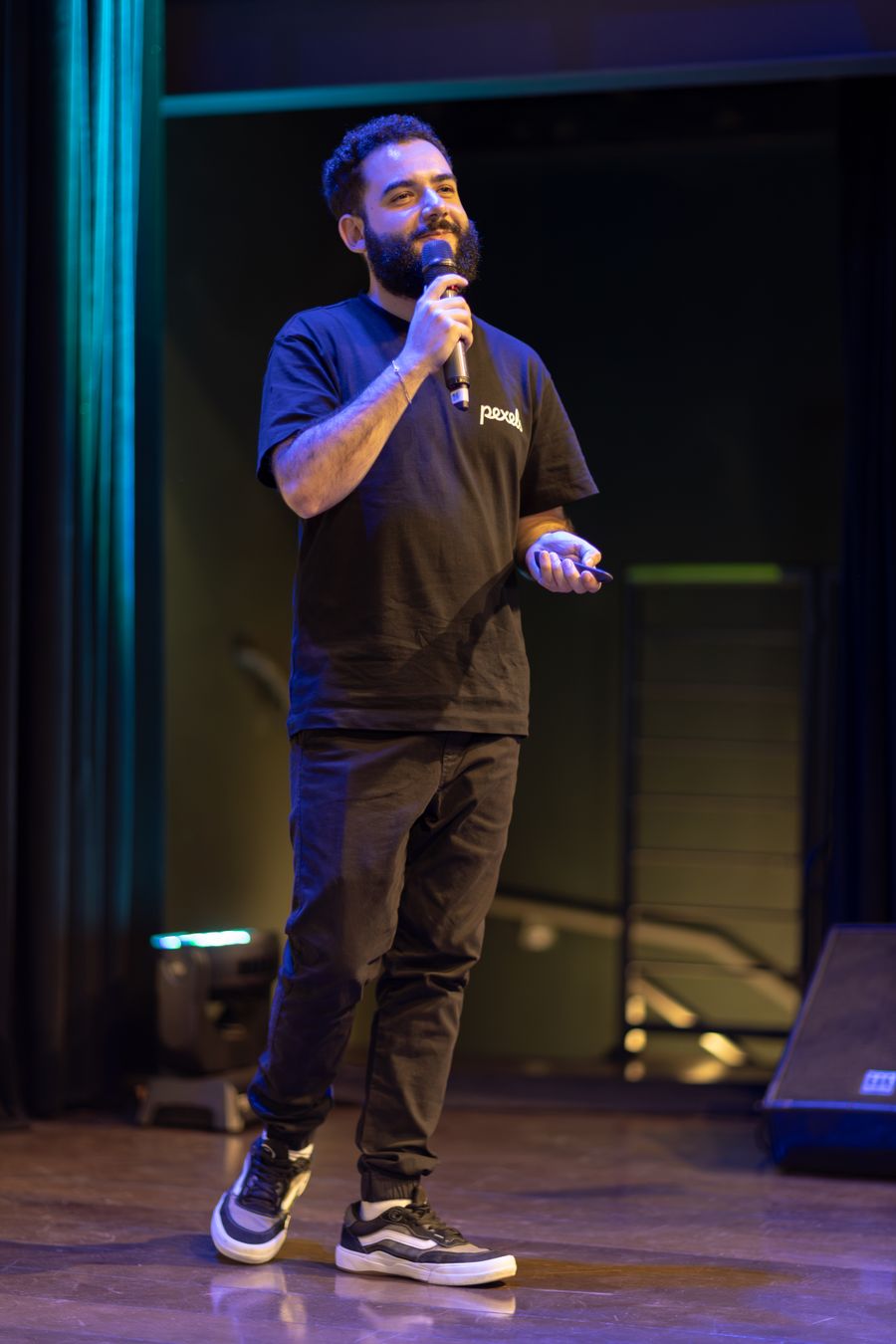 Athlete speaking on stage with microphone