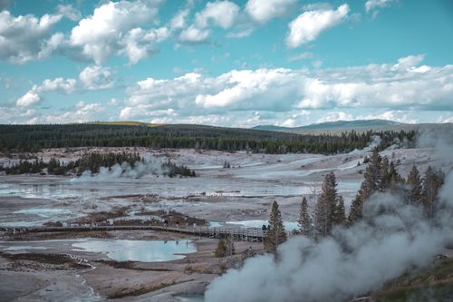 Free A captivating view of the geothermal features at Yellowstone National Park with steaming vents and scenic vistas. Stock Photo