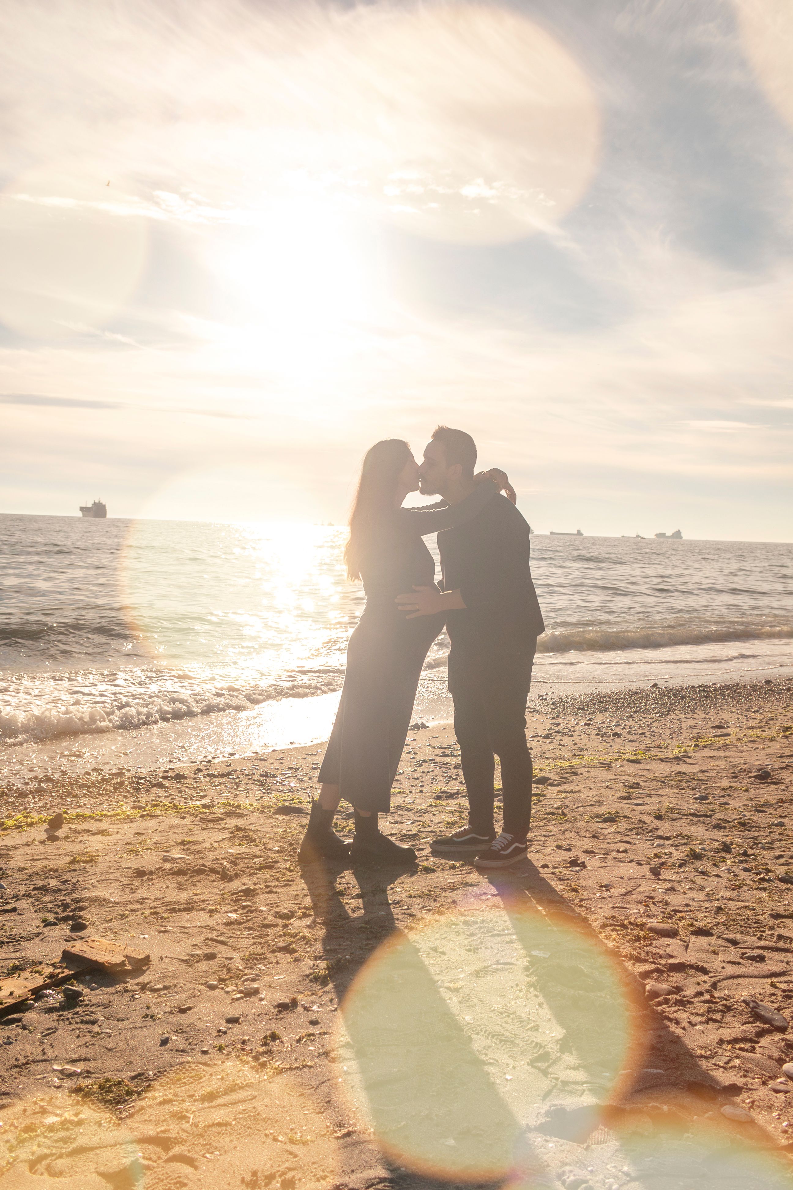 Romantic Beach Silhouette at Sunset · Free Stock Photo